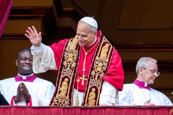 Pope Leo waves to people in St. Peter's Square
