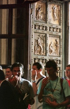 Pilgrims enter through Holy Door