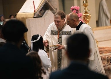 Cardinal Tobin, at Rome parish, focuses on Eucharist, not conclave