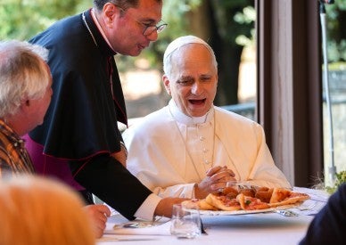 Burn with 'fire' of God's love, pope says at Mass and lunch with the poor