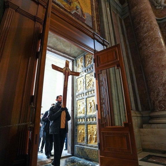 Pilgrims Walking Through Holy Door