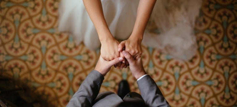 A bride and groom dancing 