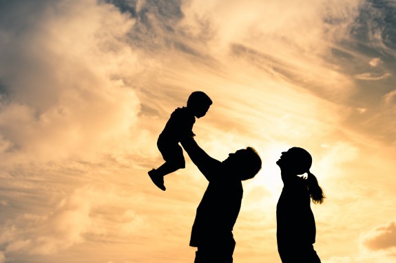 Dad throwing kid into the air silhouette 