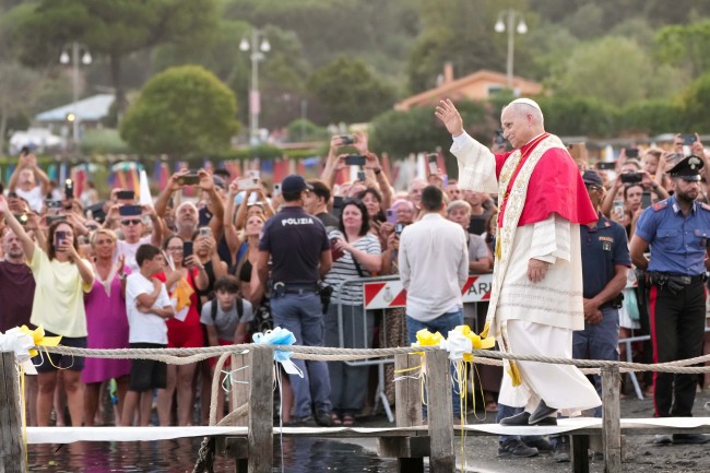 Pope Leo XIV greets the faithful and well-wishers after taking part in a Marian procession along Lake Albano in Castel Gandolfo, Italy, Aug. 29, the feast of Our Lady of the Lake. (CNS photo/Lola Gomez)  