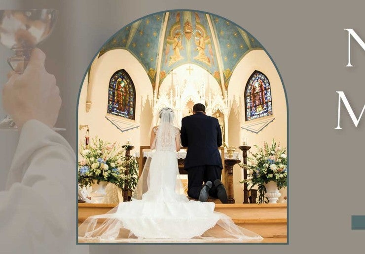 Bride and groom kneel at their wedding