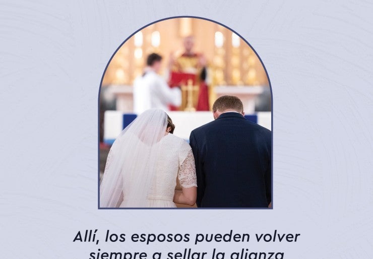 Bride and groom kneel at their wedding