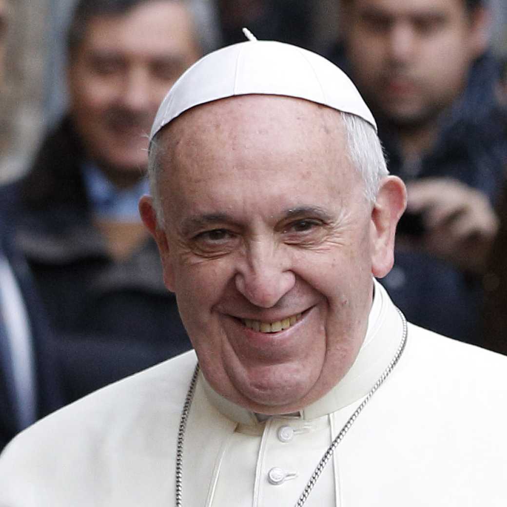 Pope Francis greets people at a General Audience.