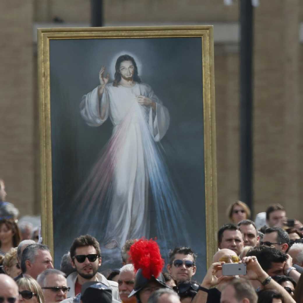 Divine mercy image in a crowd at St. Peter's Square in Rome