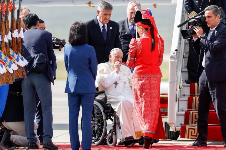 Pope Francis arrives at the airport in Ulaanbaatar, Mongolia.