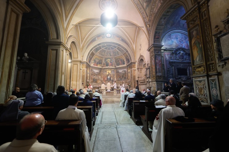 People attend a Mass in Rome celebrated by Cardinal Pierbattista Pizzaballa, patriarch of Jerusalem.