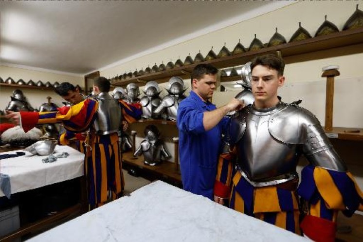Swiss Guards help each other