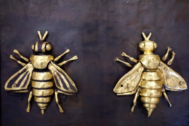 Golden bees adorning a 17th-century canopy.