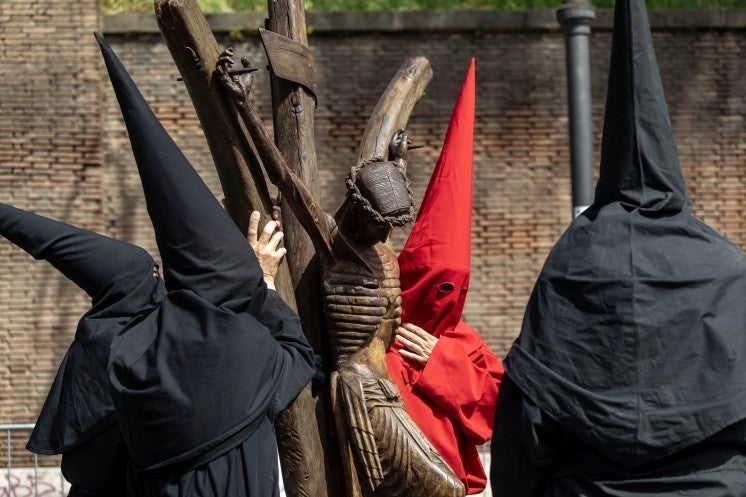 Sicilians carry a crucifix through Rome