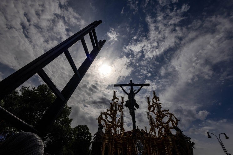 Statue of crucified Christ seen against clouds