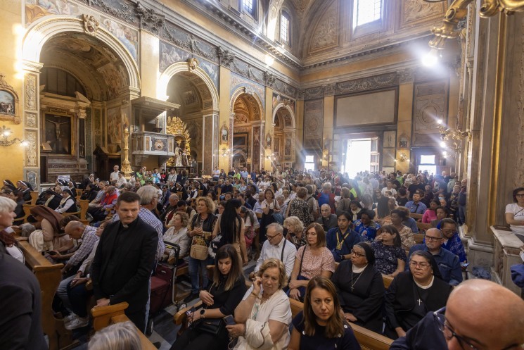 People wait to pray before the statue of Our Lady of Fatima
